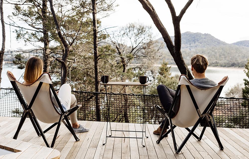 Couple relaxing in chairs at Freycinet Lodge, Tasmania