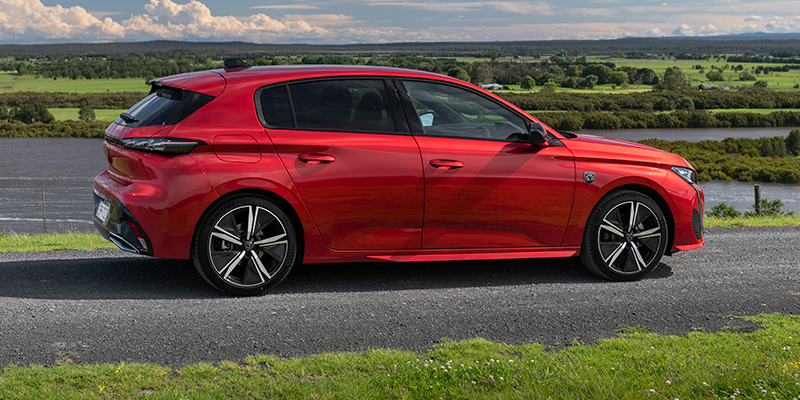 side profile of the red peugeot 308