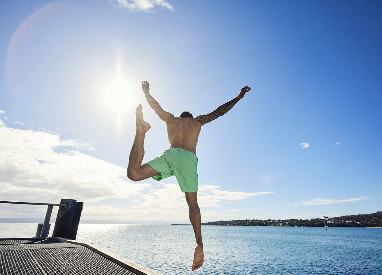 man jumping into water