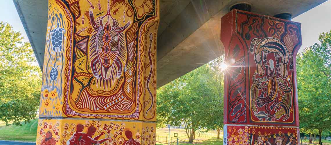 Aboriginal murals painted by indigenous artist Kym Freeman on the Cowra Bridge Pylons located beneath the Lachlan River Bridge. Destination NSW copyright