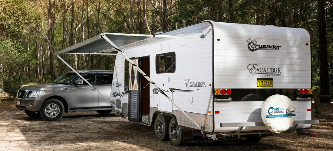 Parked Caravan with car in bush