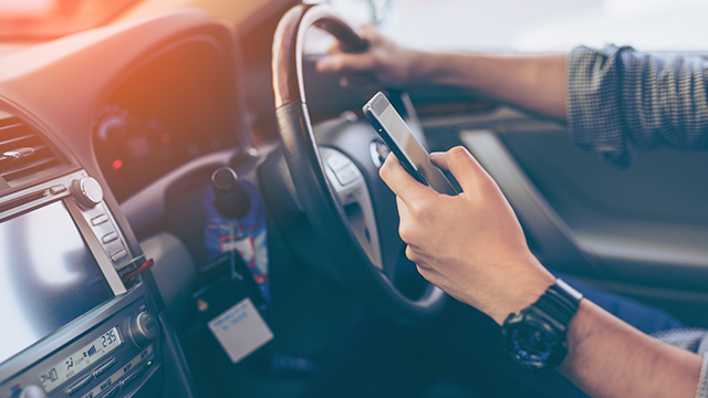 Using mobile phone while driving? Know the law | The NRMA | The NRMA