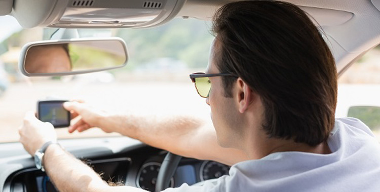 man distracted by GPS