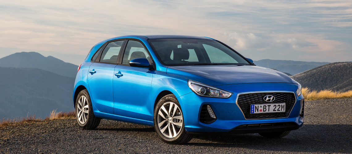 2017-Hyundai-i30-blue-hero-shot