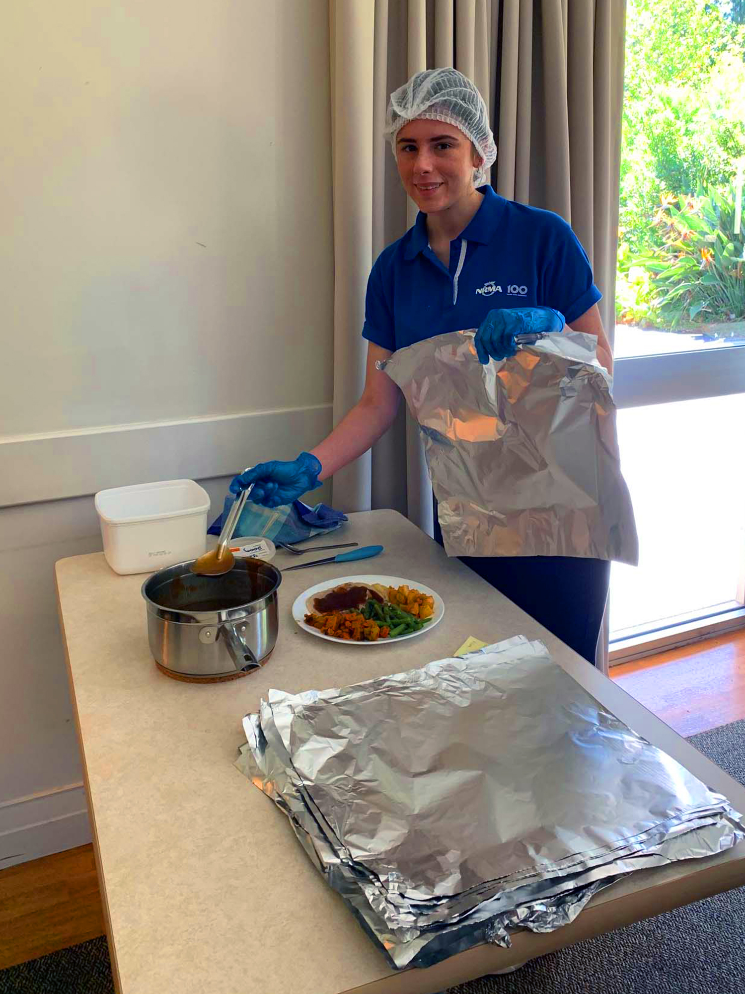 PLH Alexa Hillard Gardiner preparing meals for the residents of Yallambee Village in West Gosford