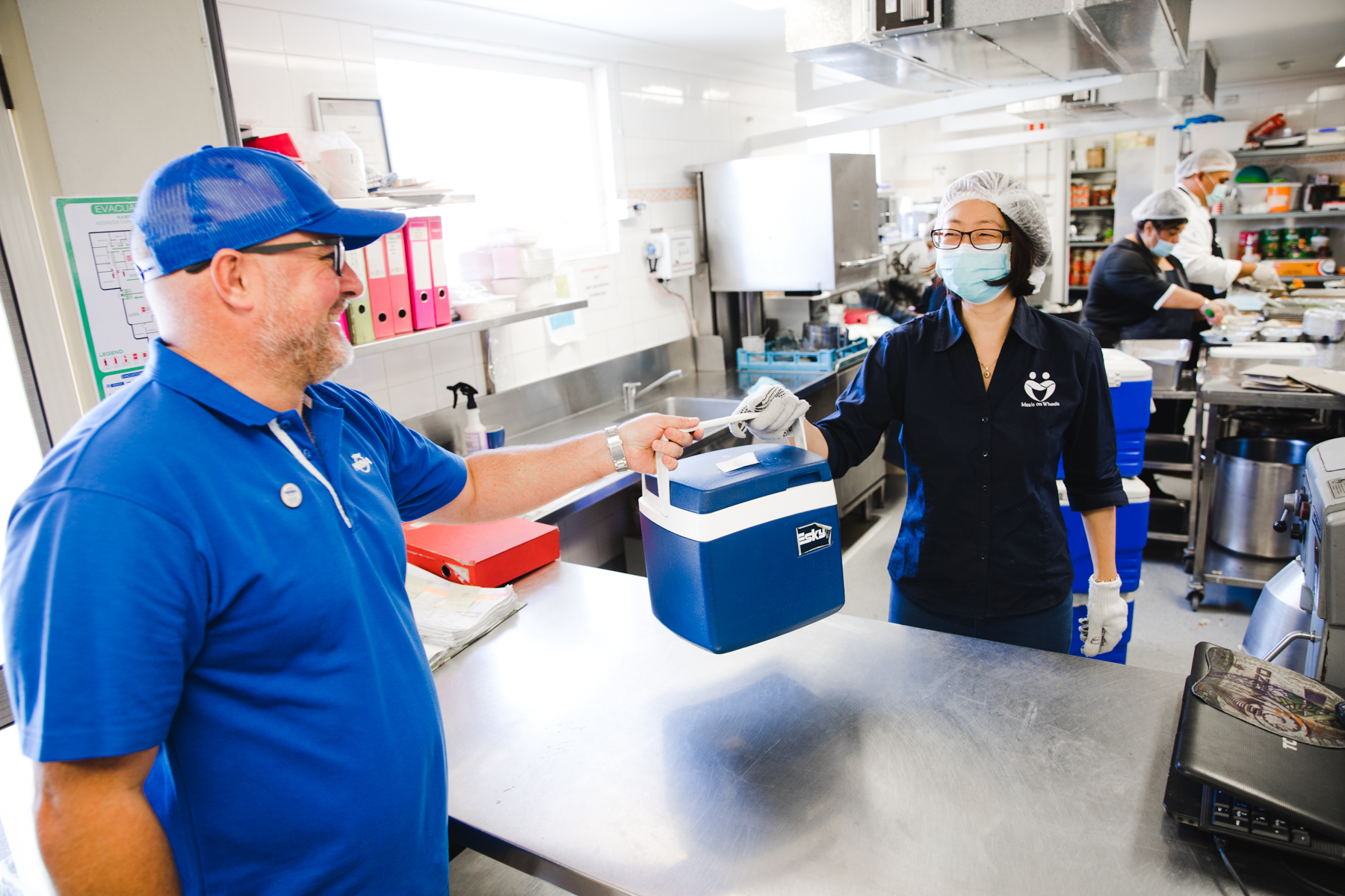 PLH NRMA's James Simmons picking up meals to deliver to the vulnerable elderly and isolated