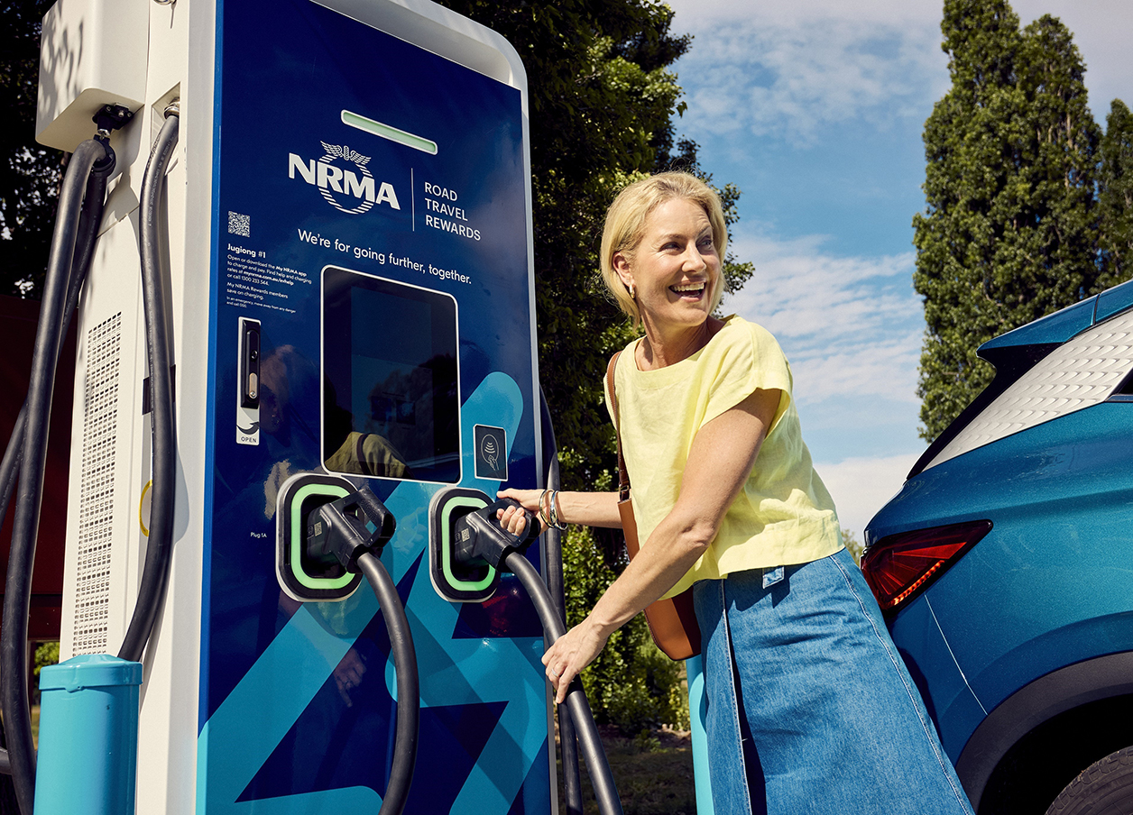 woman at nrma electric charging station