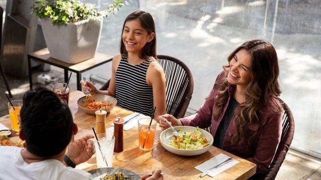 Family dining out and saving with member benefits