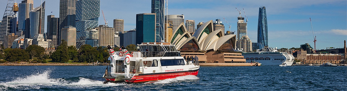 Cruising Sydney Harbour past the Opera House