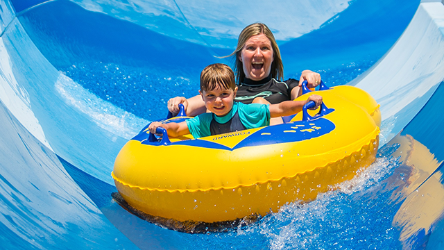 Family riding the flume at Raging Waters Sydney