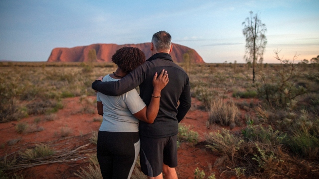 Couple looking at Uluru