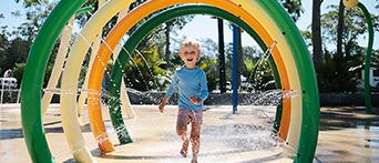 Child water play at NRMA Ocean Beach Holiday Resort