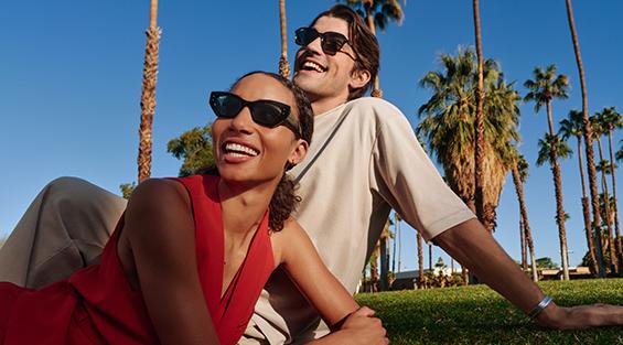 Sunglass Hut couple on grass wearing sunglasses