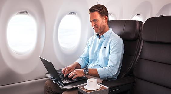Business man flying Qantas