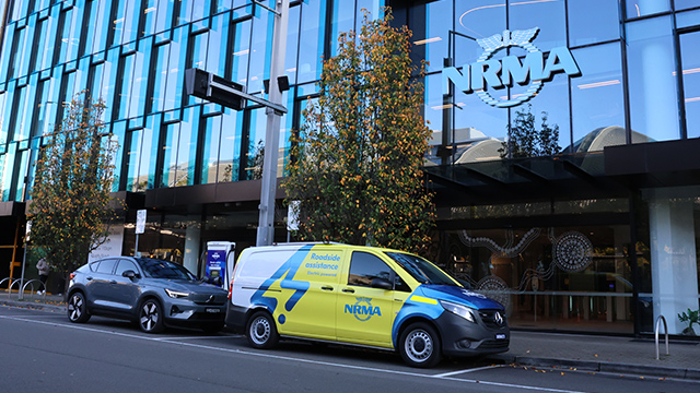 Electric car and NRMA electric patrol van parked on the street outside office