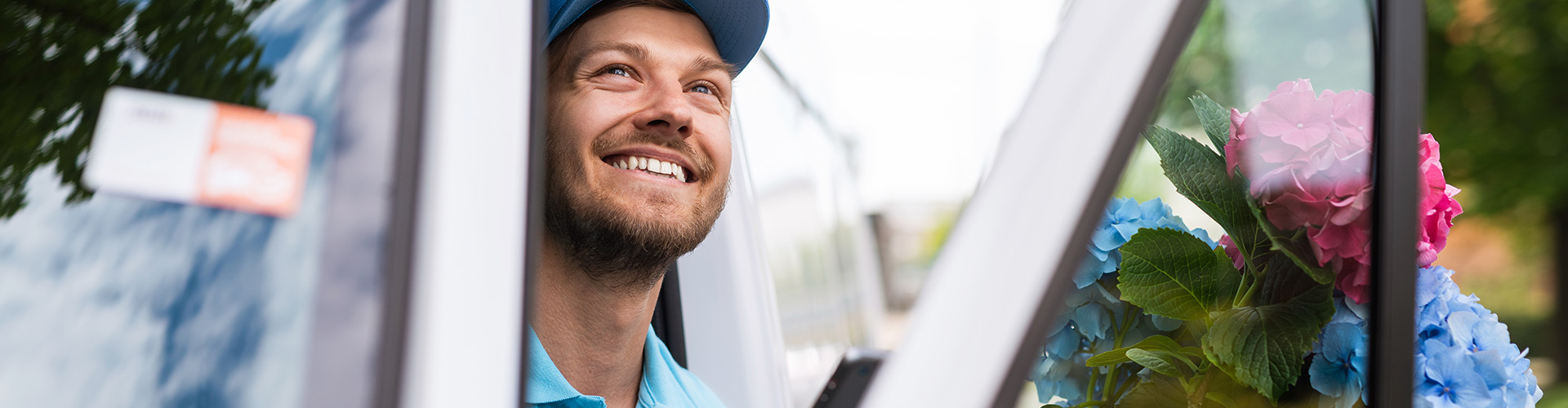 Florist looking outside whilst in their van