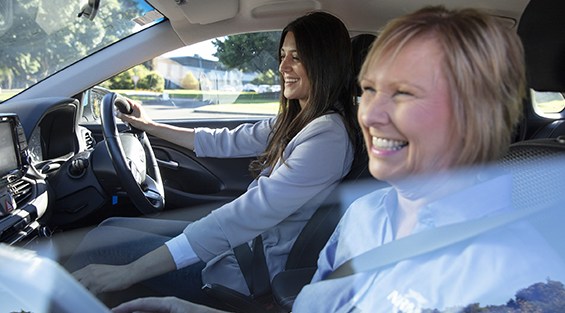 Women in car coaching driving