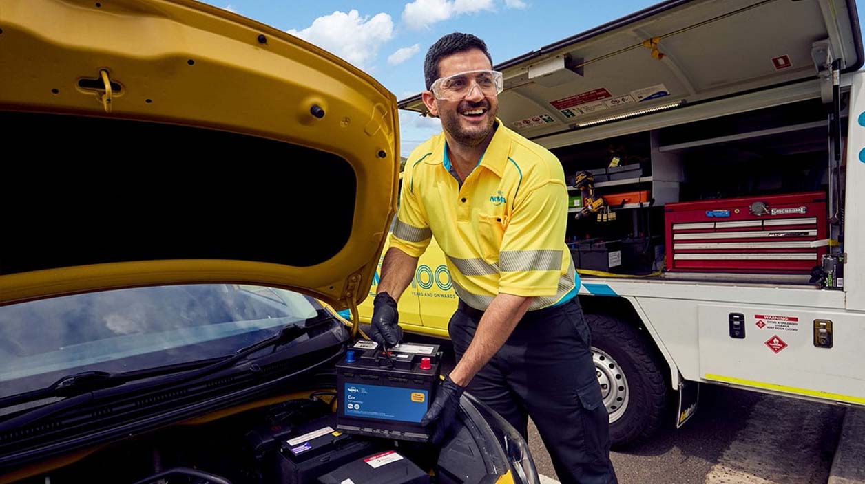 An NRMA technician changing out a car battery