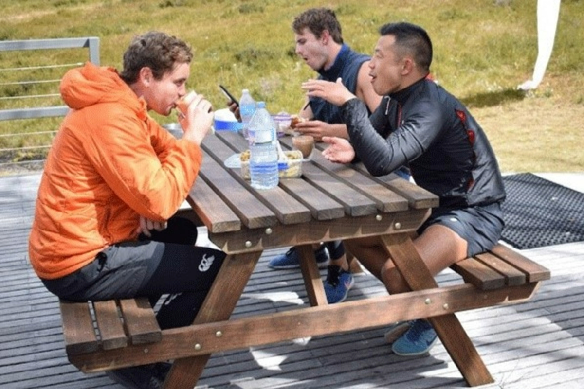 three-men-lunch-at-table-1200x800 Slide 2