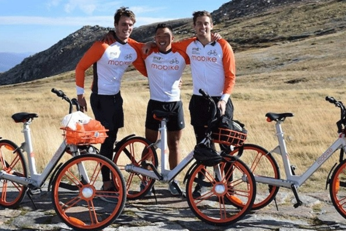 three-men-pose-with-bikes-1200x800 Slide 1