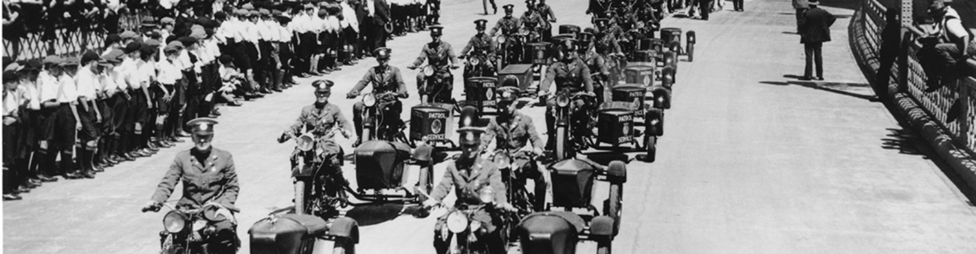 1932 Sydney harbour bridge opening NRMA patrols lead parade fleet of NRMA patrolmen, two a breast, on motorcycles leading the procession crossing the sydney harbour bridge at its opening ceremony in 1932