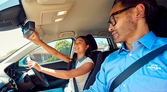 An NRMA Driving Instructor in the car with a student
