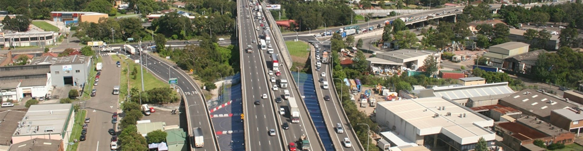 Ariel view of busy highway roads with lots of traffic.