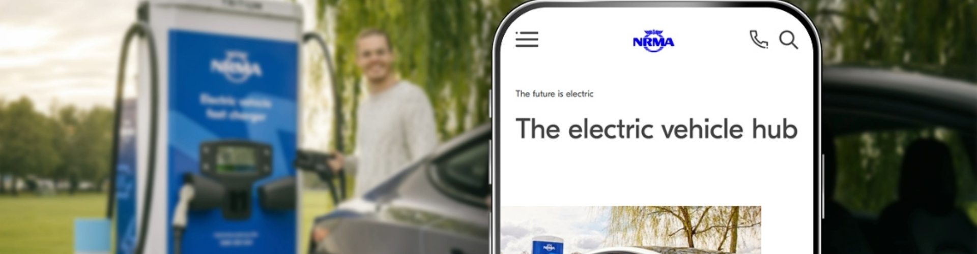 man-using-an-nrma-fast-charger-1920x500 A man using an NRMA fast charger in the background, with a cellphone screen displaying an NRMA article in the foreground.