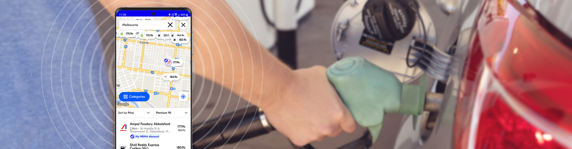 my NRMA rewards fuel alert Melbourne image of mobile phone with fuel app open in foreground with blurred image of person filling up their car with petrol in the background