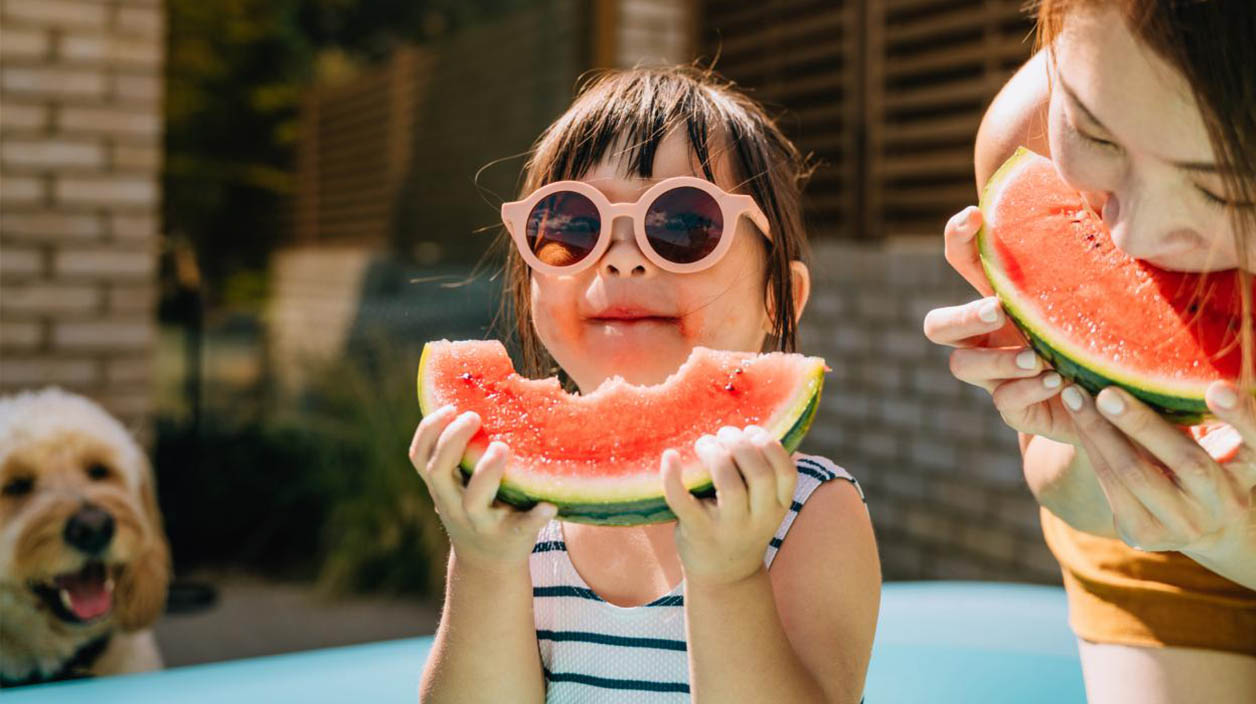 Family eating watermelon