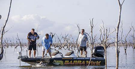 Three men fishing from boat, credit: Tourism and Events Queensland