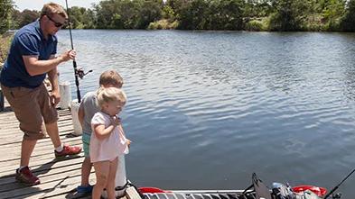 Family fishing from private jetty
