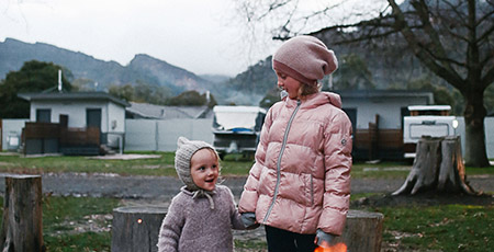 Children by communal firepit
