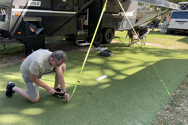 Pegging an awning on a caravan