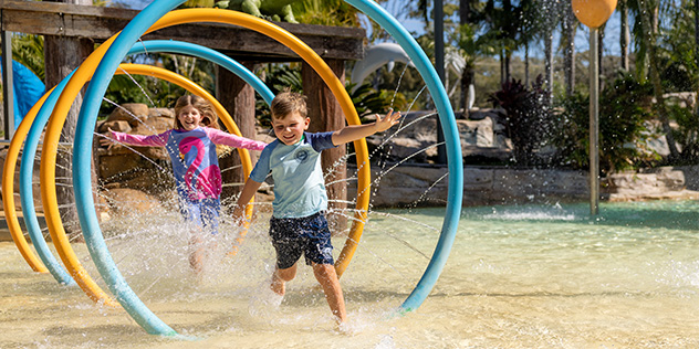 Kids playing in the water at an NRMA holiday park