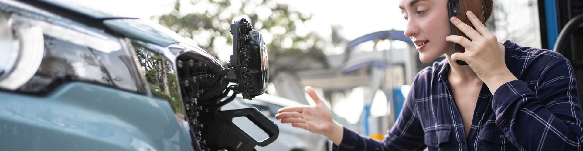 Woman call mobile phone about Accident and breakdowns with EV Charger at station. Broken down car, blonde woman having problem, calling to somebody for help. Worried person on phone while charging EV