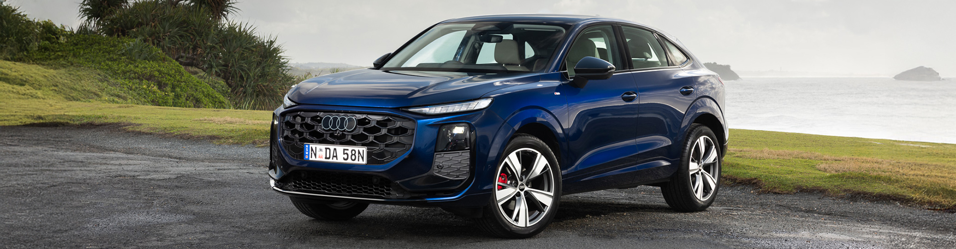 Dark blue Audi Q3 front angle view