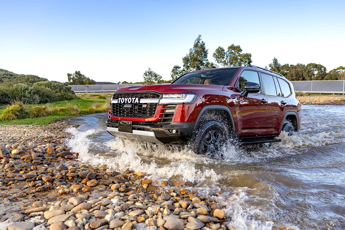 2026 Toyota Landcruiser 300 series driving through creek