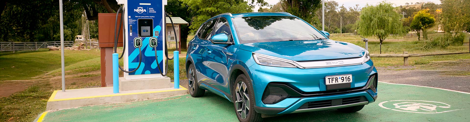 A blue Atto 3 charging at an NRMA charger