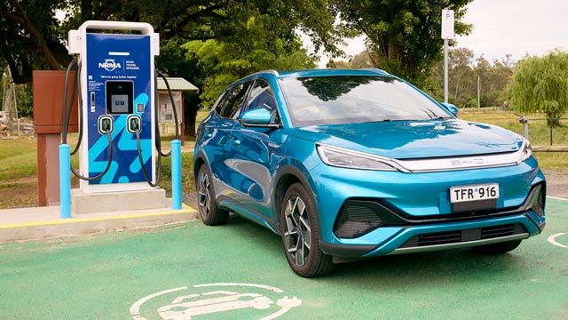 A blue Atto 3 charging at an NRMA charger