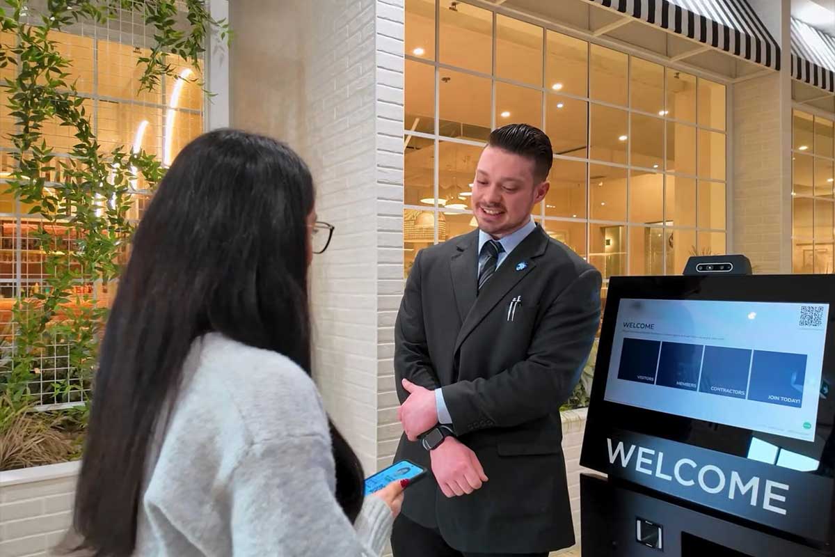 Woman at entry to nsw service club talking to host