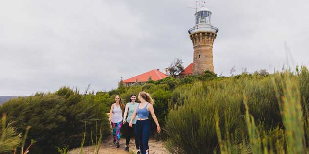 Friends enjoying a walk along the Barrenjoey Lighthouse walk, Palm Beach