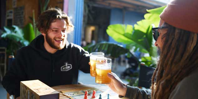 Friends enjoying a board game and drinks at Jervis Bay Brewing Co.