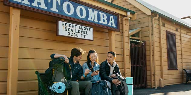 Young people catching a train at Katoomba train station.