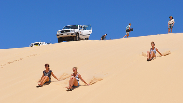 Sandboarding on Stockton Beach