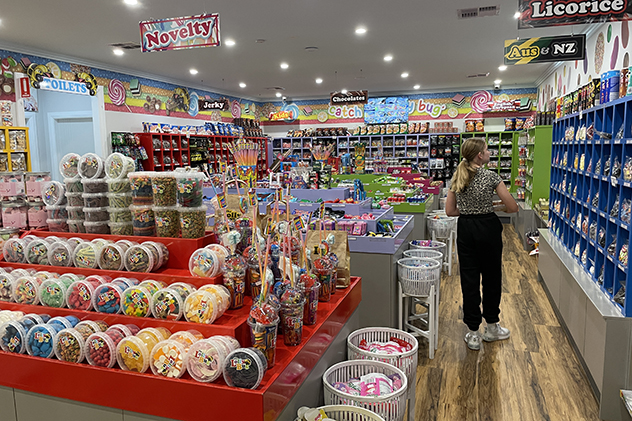 A girl browsing a lolly shop