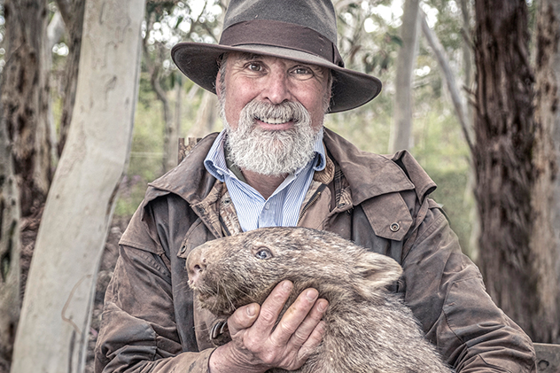 John Creighton with a rescued wombat.