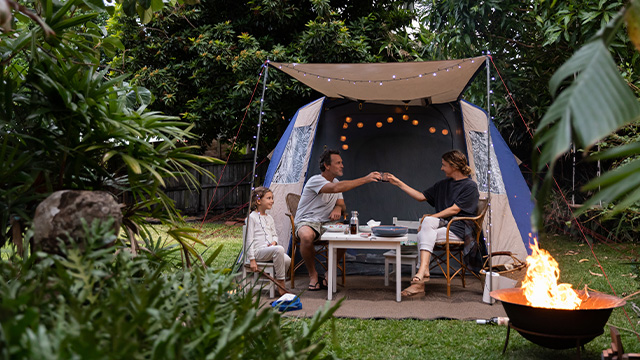 Family camping in the backyard