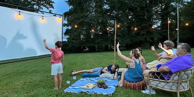 Family at an outdoor backyard cinema