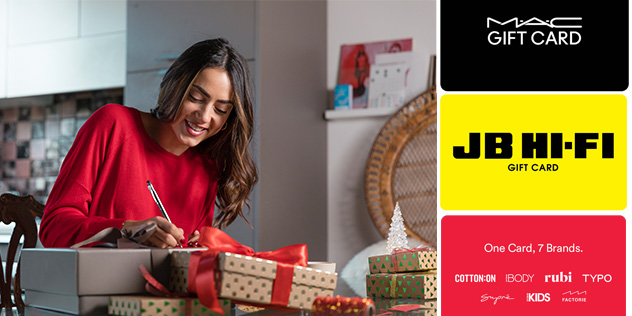 A woman writing cards for gifts